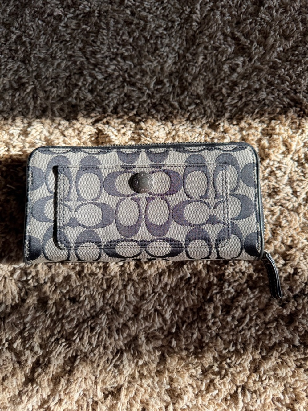 Coach Khaki and Black Signature Zip Wallet.